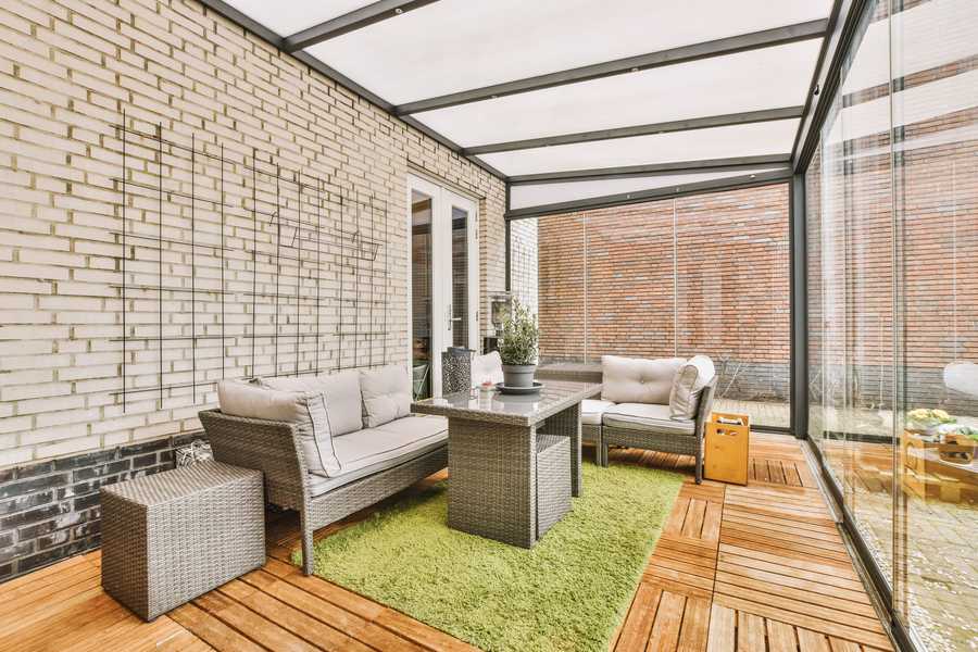 Neat screened patio with sitting area