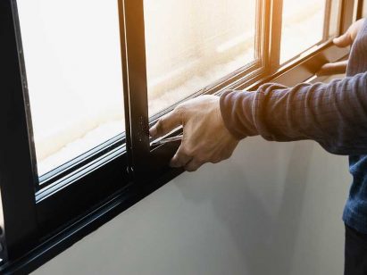 Expert working on Impact Windows installation